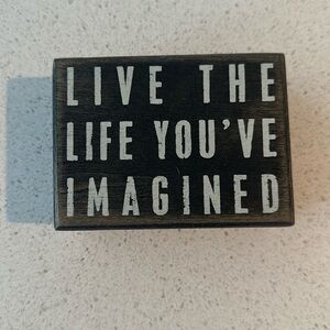 “Live the life you’ve imagined” black box sign